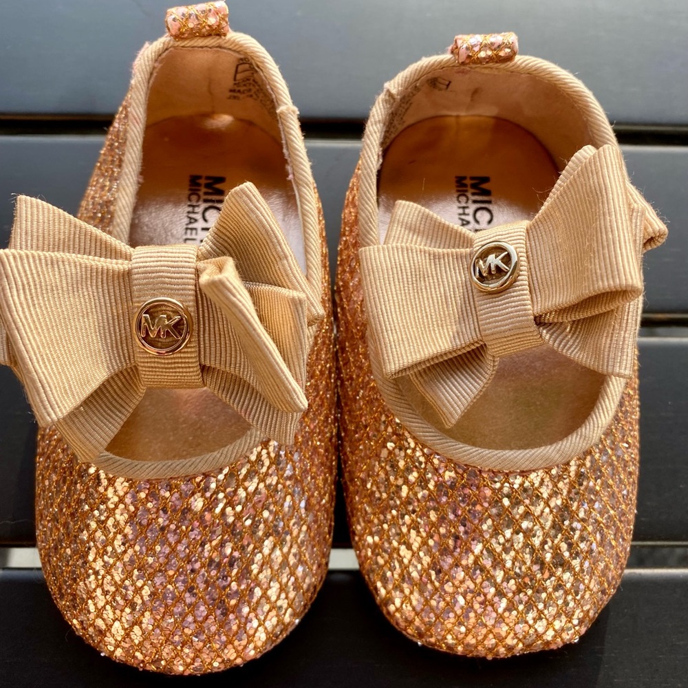 Shiny gold Michael Kors baby slippers